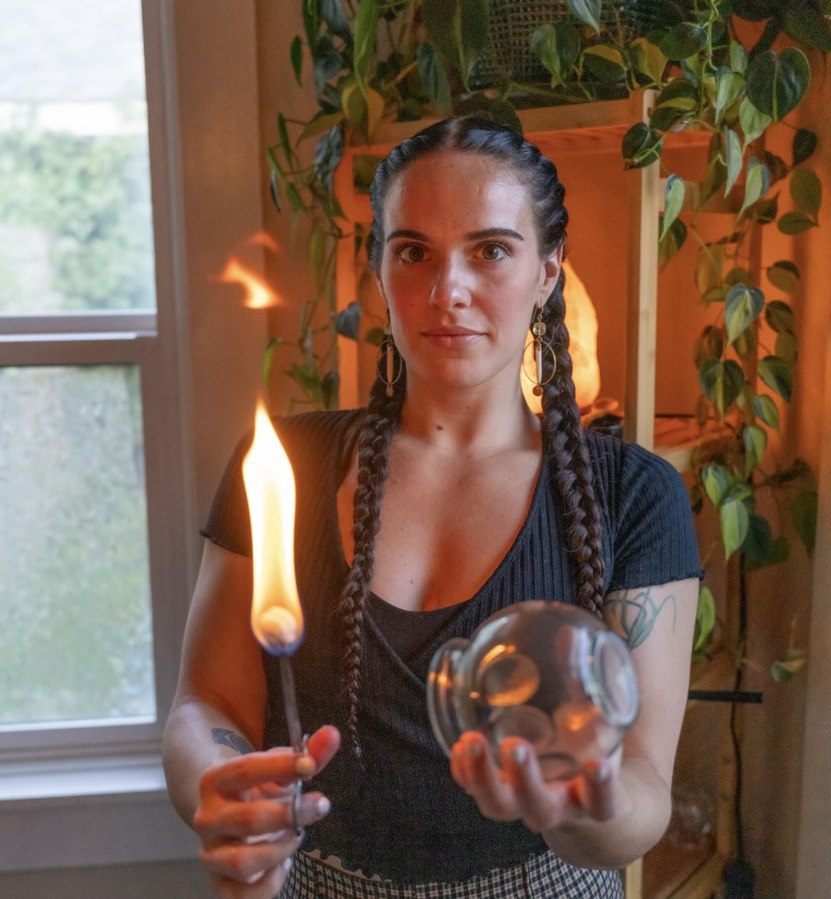 Woman holding fire cup